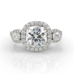 Cushion-cut three-stone ring
