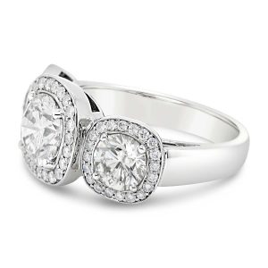 Platinum-3-stone-diamond-ring-with-cushion-diamond-halos