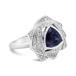 Trillion cut tanzanite with a fancy diamond halo set in 14k white gold