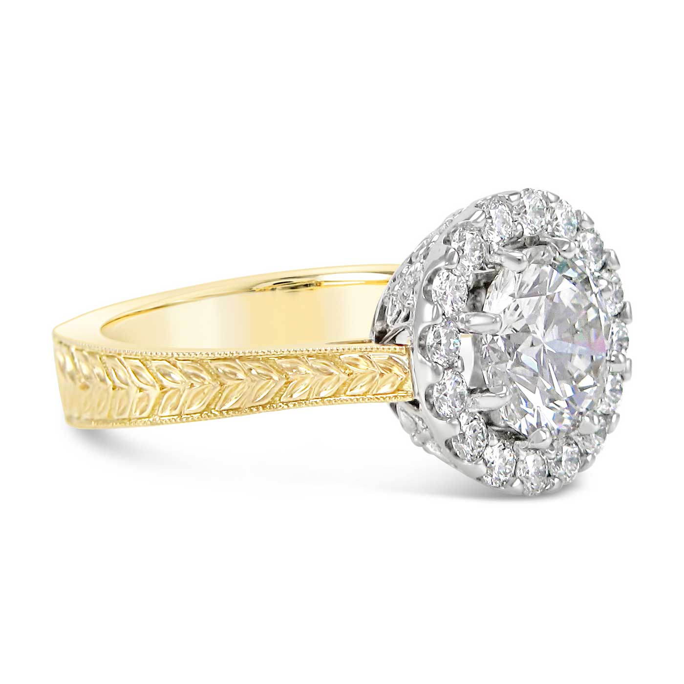 Vintage inspired 19k white and 18k yellow gold engagement ring set with a 2ct center stone and a diamond halo